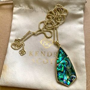 Kendra Scott long gold necklace with abalone stone.